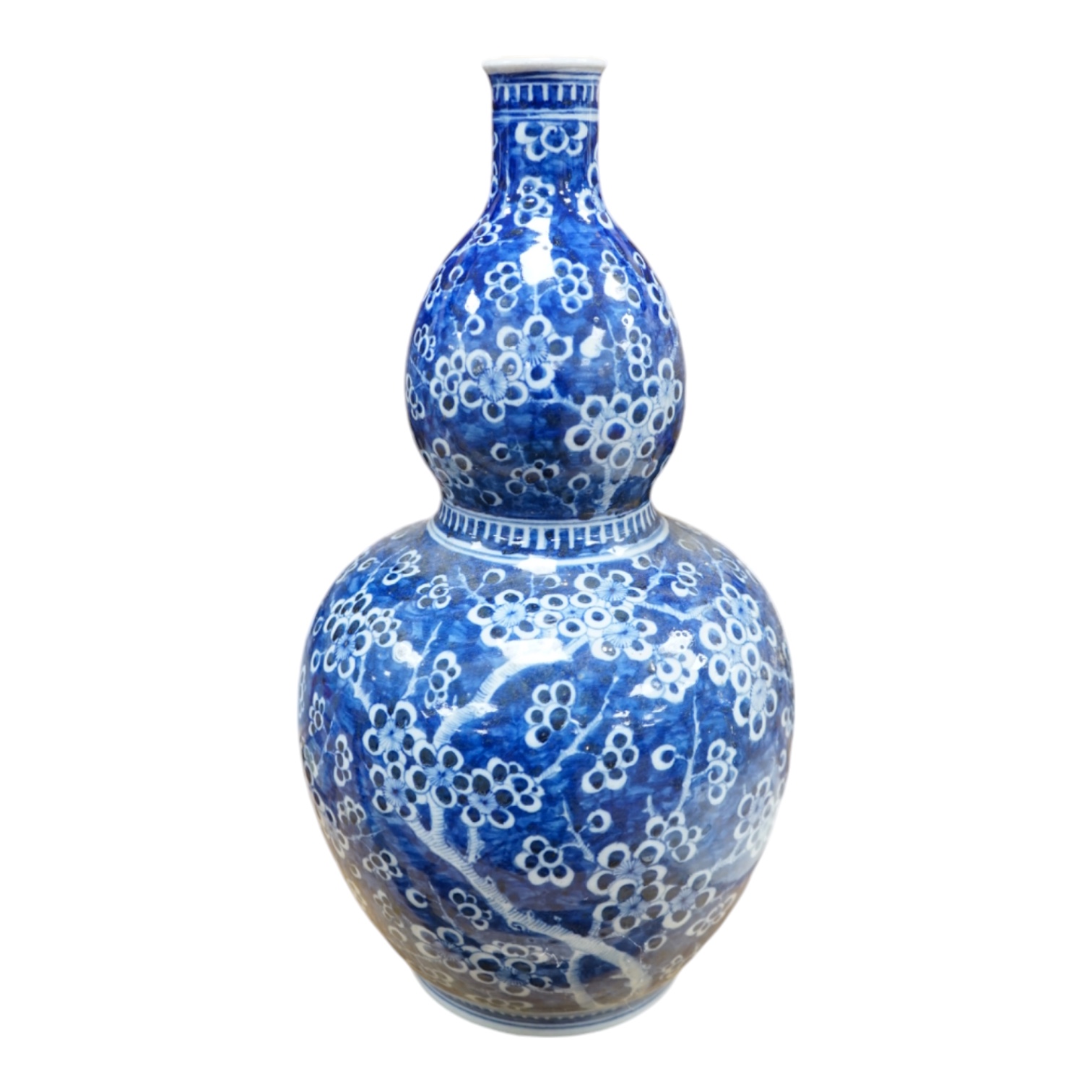 A Chinese blue and white prunus double gourd vase, 45cm high. Condition - fair